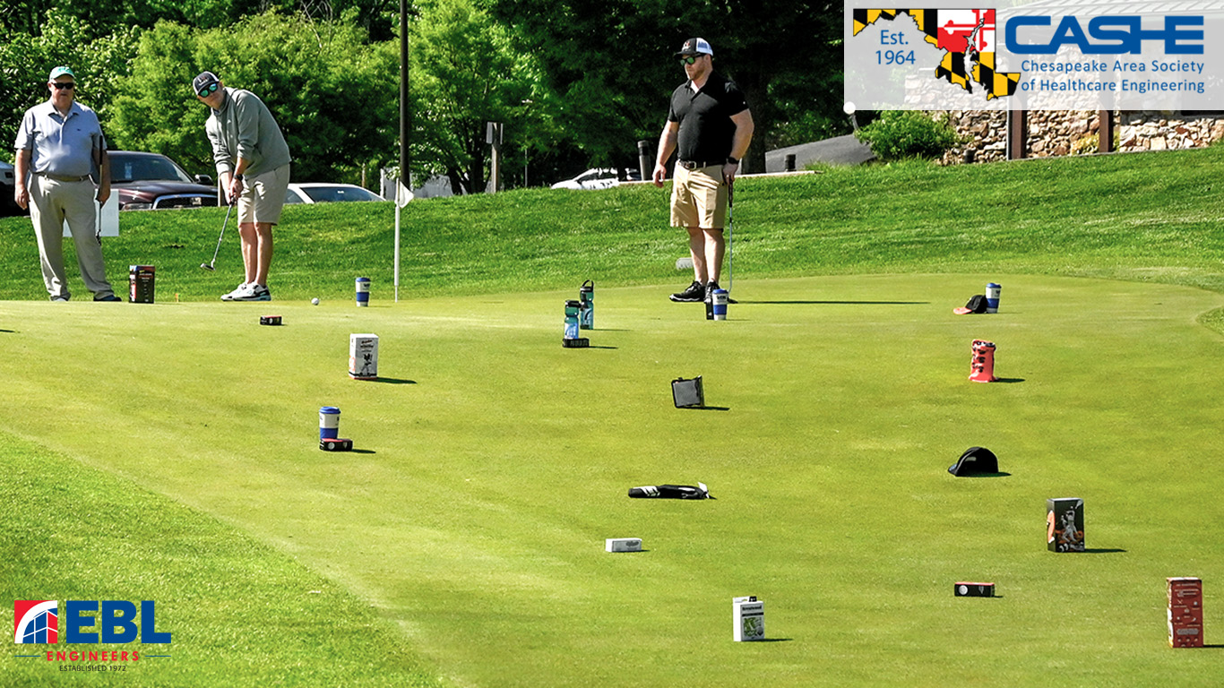 Three golfers on putting green with items all over green
