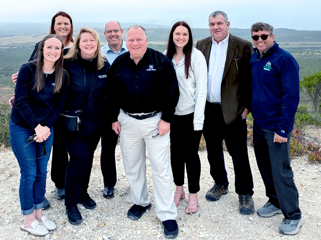 Group of 8 posing for picture